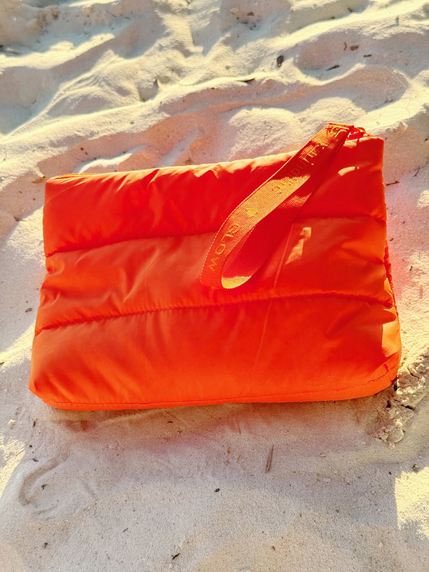 Quilted Orange Puffer Skincare Clutch